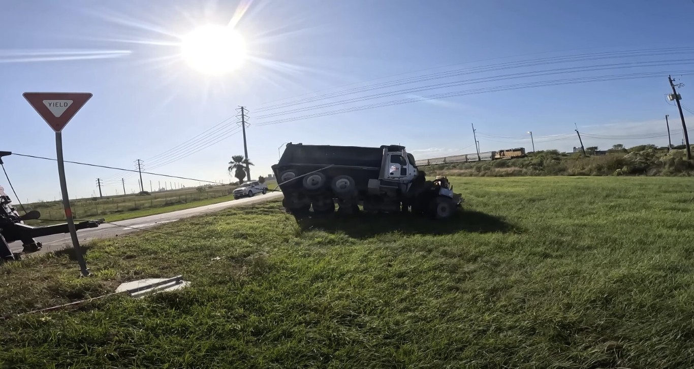 Heavy duty truck being winched out of a ditch during accident recovery in Lindenhurst, NY