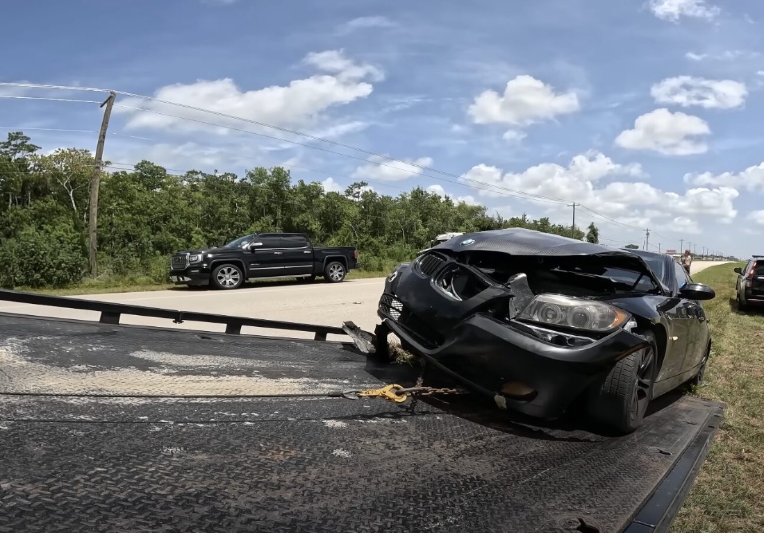 Accident recovery towing of wrecked vehicle on highway in Lindenhurst, NY